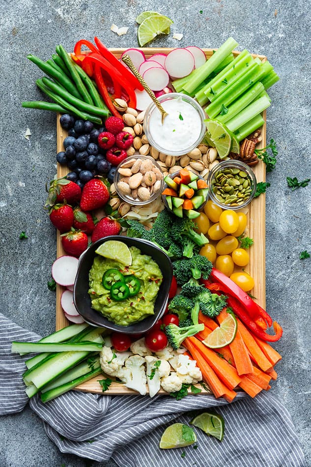 Color vegetable platter garnished with carrots and guacamole