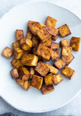 Top view of tofu cubes in a white bowl