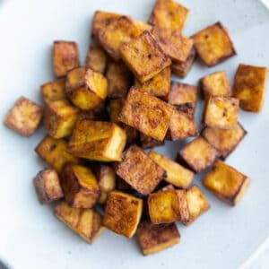 Top view of tofu cubes in a white bowl