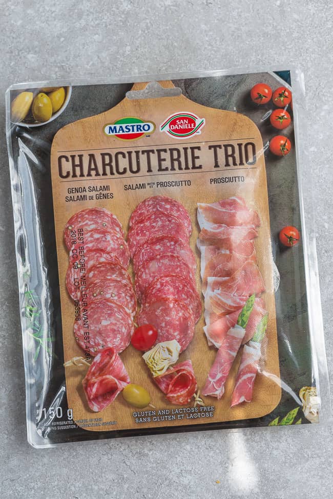 A package of a salami trio: genoa salami, salami with prosciutto, and prosciutto