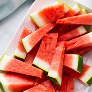 Pinterest graphic of watermelon cut into spears.