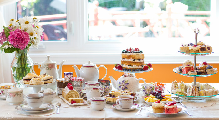 Table setup with tea and treats for a tea party