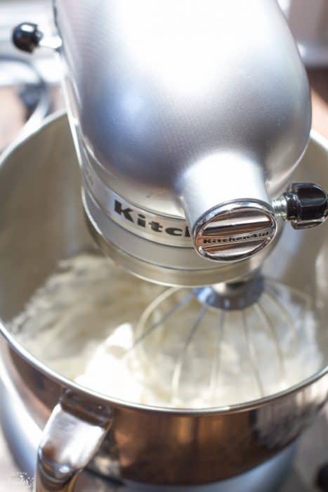 Overhead view of whipped cream being made in a stand mixer