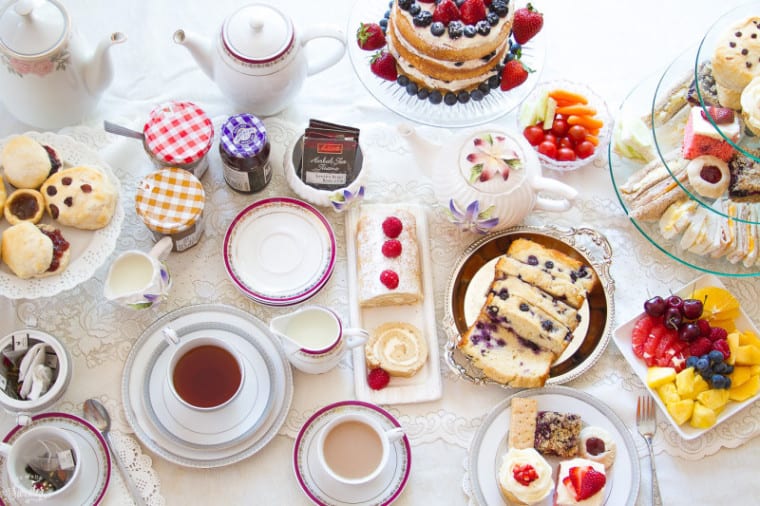 Overhead view of tea and treats on a table for a tea party