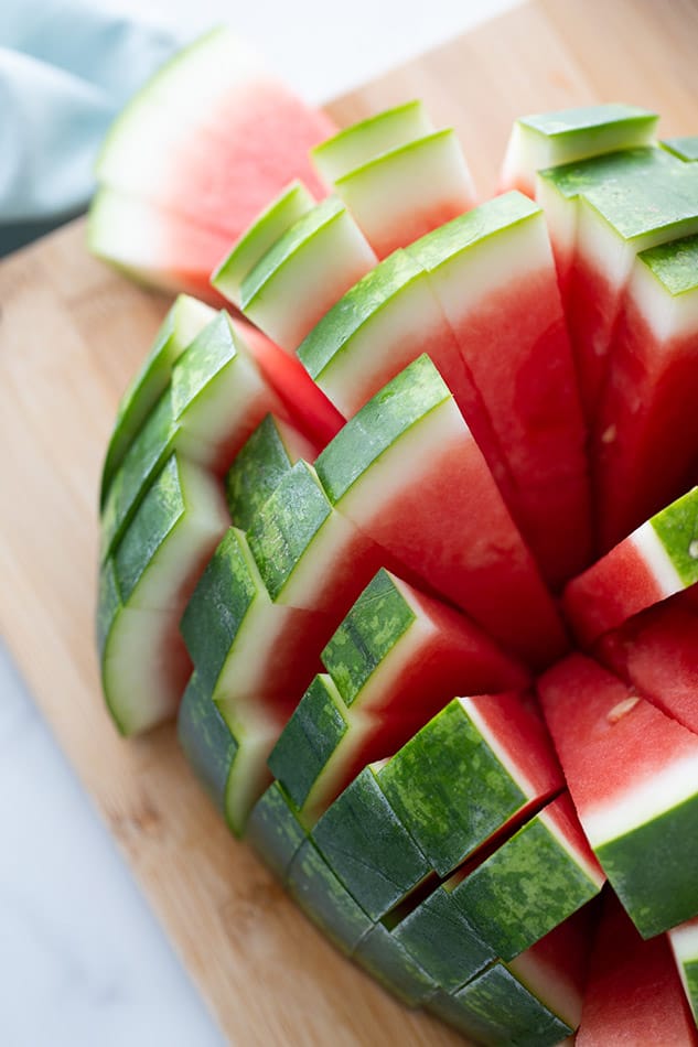Side view of how to cut a watermelon in tiny pieces.