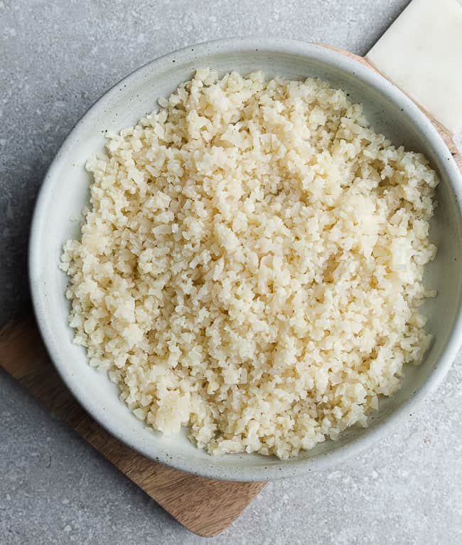 Top view of a bowl of easy cauliflower rice without a food processor