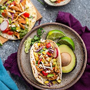 Instant Pot Chicken Tacos come together in under 30 minutes in your pressure cooker for the perfect weeknight meal! Cooks up tender, juicy and full of flavor with a homemade Tex Mex taco seasoning and fire roasted tomatoes. Best of all, low carb, keto & paleo friendly options.