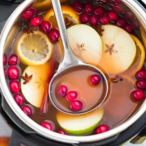 Image of instant pot apple cider with lemons, oranges and cranberries