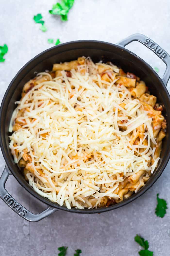 comforting baked ziti topped with shredded cheese