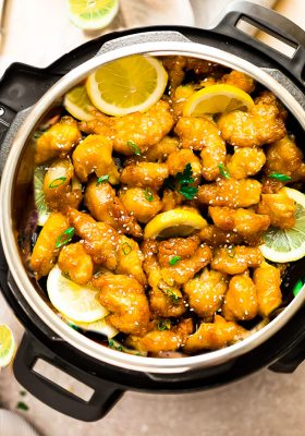 Instant Pot Chinese Lemon Chicken - an easy homemade pressure cooker recipe of the classic Asian Takeout-Style Lemon Chicken. This healthier low carb / keto version of the popular favorite has a light and crispy coating covered in a flavorful sweet, savory and tangy lemon sauce.
