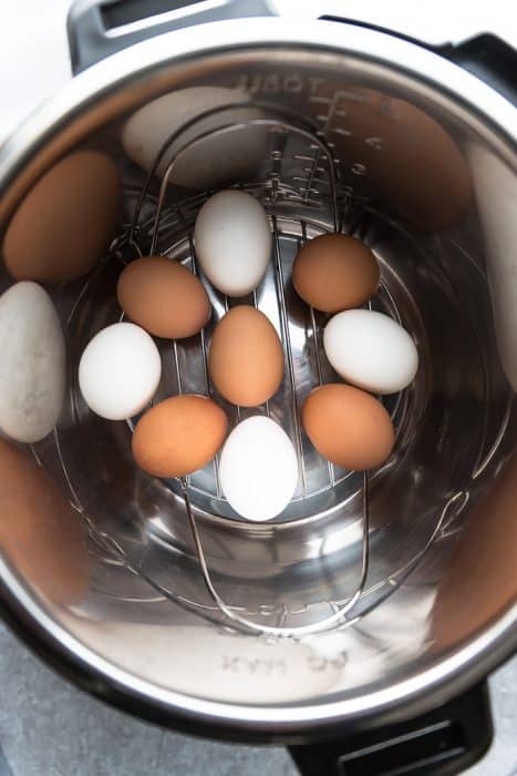 Nine White and Brown Eggs on an Instant Pot Steamer Rack