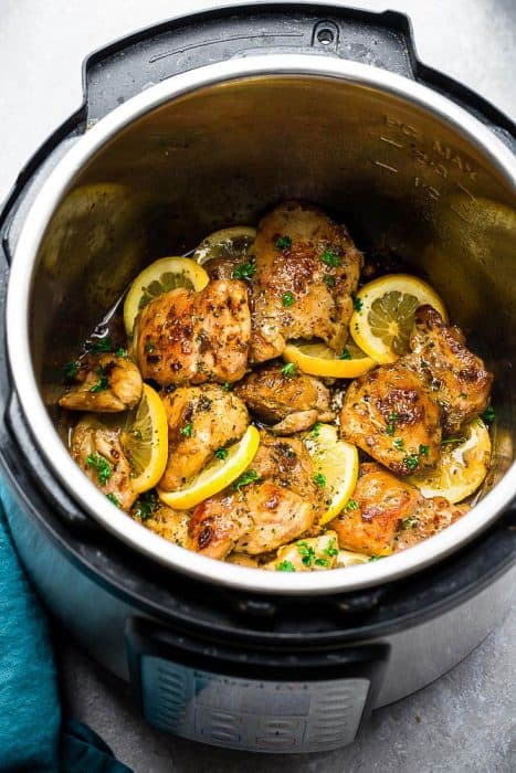 Instant Pot Lemon Garlic Chicken - the perfect low carb & keto friendly meal for spring. Best of all, this recipe is super simple and the chicken cooks up tender, juicy and full of flavor with instructions for the pressure cooker and stovetop. Serve with roasted asparagus, broccoli, zucchini, green beans, cauliflower or your favorite vegetable. Great for meal prep Sunday to make ahead for work or school lunchboxes & lunchbowls