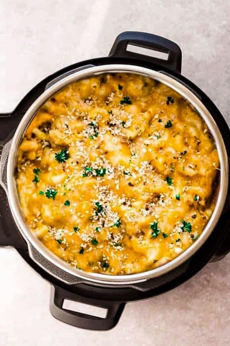 Top view of macaroni and cheese in an Instant Pot with gluten free panko crumbs and parsley
