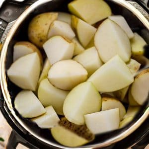 Top view of cut Russet potatoes in a pressure cooker