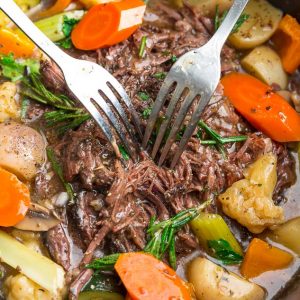 Two Metal Forks Digging Into the Beef in an Instant Pot Roast