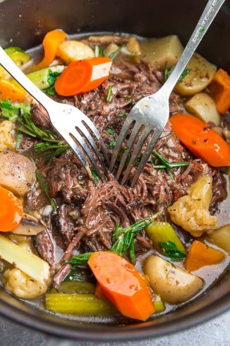 Two Metal Forks Digging Into the Beef in an Instant Pot Roast
