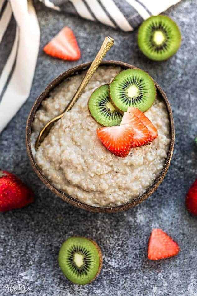 A Bowl of Oatmeal Topped with Sliced Kiwis and Strawberries
