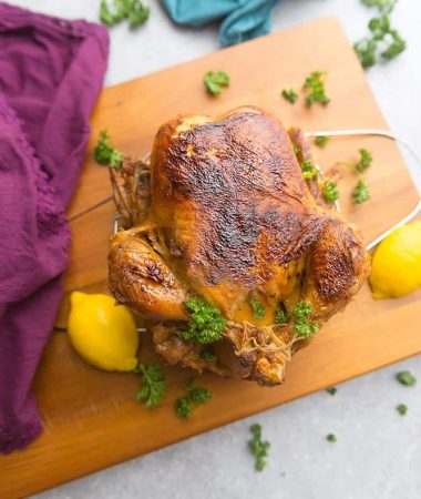 Instant Pot Whole Rotisserie Chicken - perfectly tender, juicy, roasted chicken you can make easily at home using your Instant Pot pressure cooker. Best part of all, you can have a simple chicken dinner in under 45 minutes. Plus instructions for cooking the chicken in the oven, thawed and frozen. No more dry chicken breasts - so juicy and moist & great for Sunday meal prep. Use your leftovers for soups, pastas, casseroles, tacos, bone & chicken broth and more!