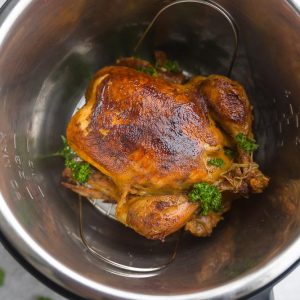 Instant Pot Whole Rotisserie Chicken - perfectly tender, juicy, roasted chicken you can make easily at home using your Instant Pot pressure cooker. Best part of all, you can have a simple chicken dinner in under 45 minutes. Plus instructions for cooking the chicken in the oven, thawed and frozen. No more dry chicken breasts - so juicy and moist & great for Sunday meal prep. Use your leftovers for soups, pastas, casseroles, tacos, bone & chicken broth and more!