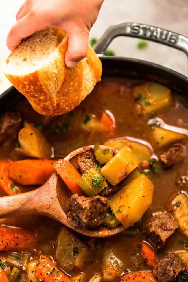 Close-up view of Irish Beef Stew with a spoon and bread
