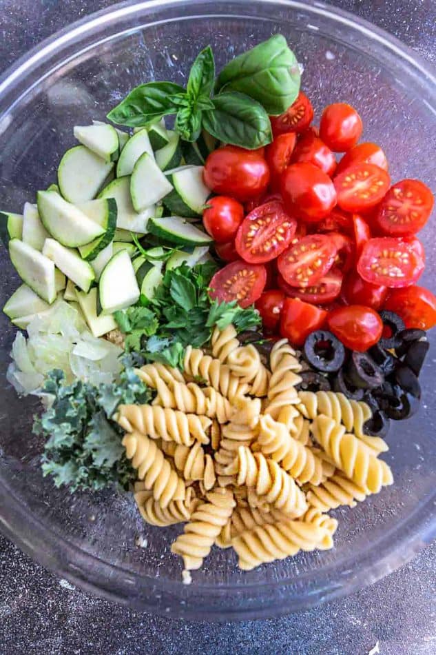 Top view of Summer Pasta Salad ingredients in a mixing bowl