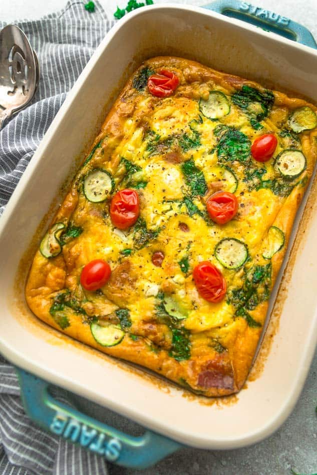 Side view of low carb breakfast egg casserole in a blue casserole pan