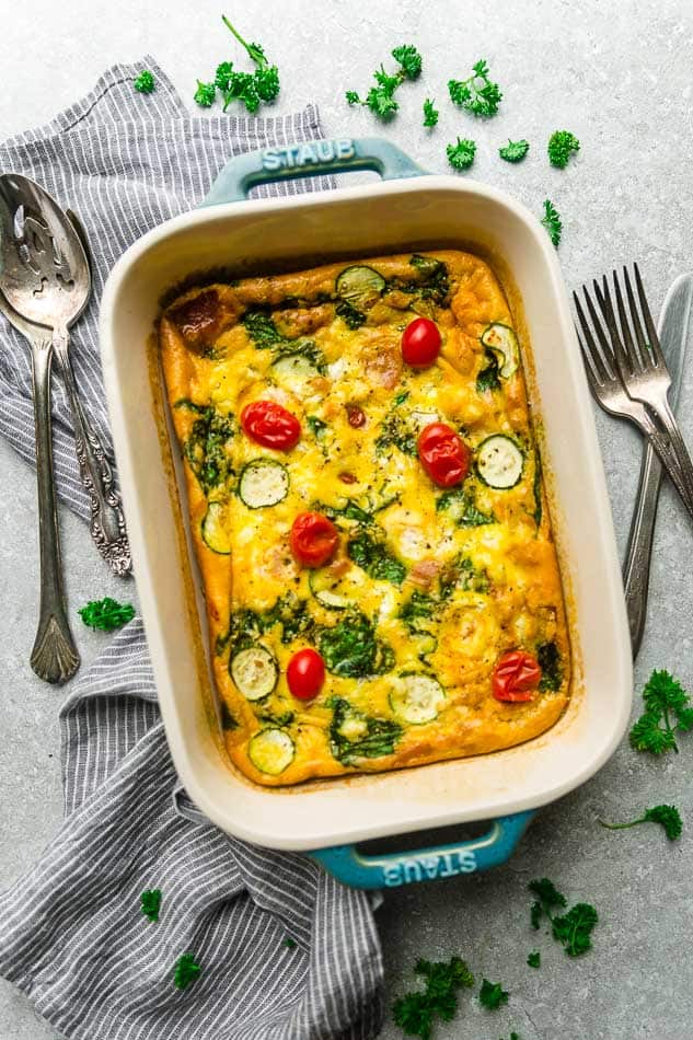 Top view of low carb breakfast egg casserole in a blue casserole pan