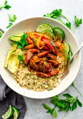 Keto Chicken Burrito Bowls served in a white bowl with a fork