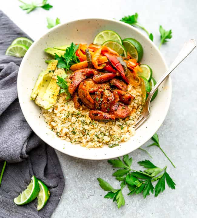 Keto Chicken Burrito Bowls served in a white bowl with a fork