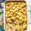 Top view of Vegan Cauliflower Mac and Cheese in a white baking dish with a serving spoon