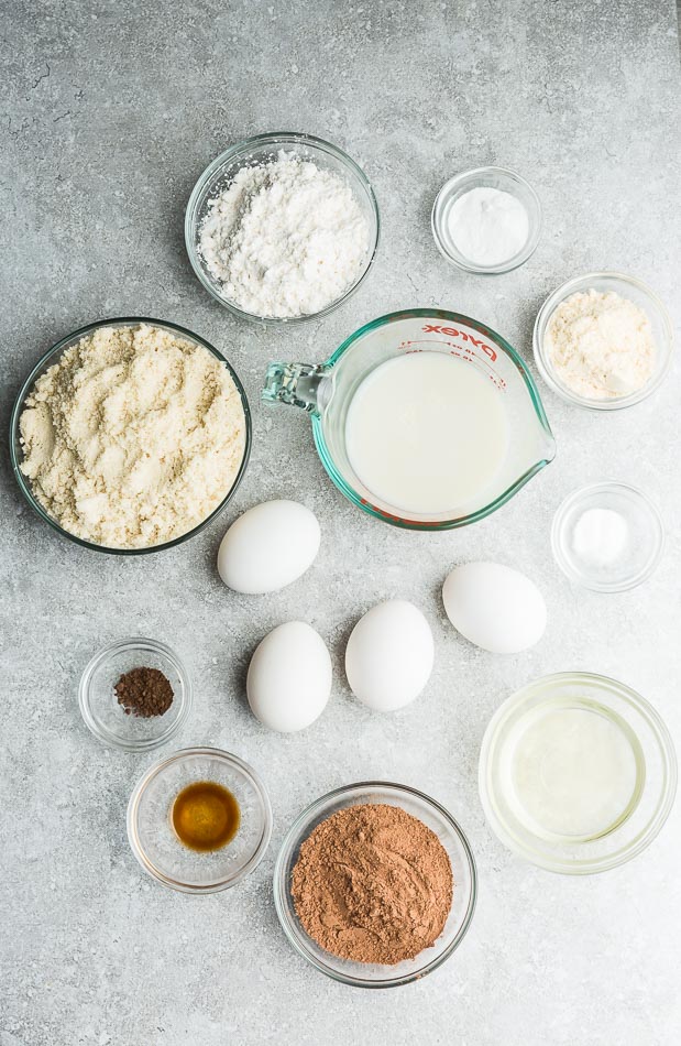 Top view of ingredients to make chocolate cookies on a grey background