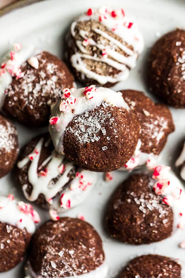 Close up view of keto chocolate peppermint cookies stacked on a white plate