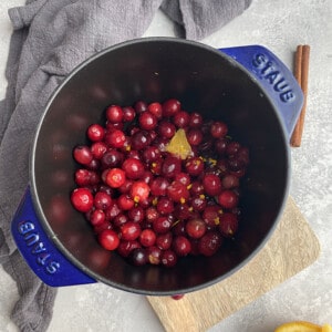 Top view of keto cranberry sauce in a blue pot