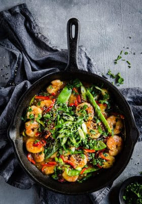 Top view of Keto Shrimp Stir Fry in a black cast iron pan