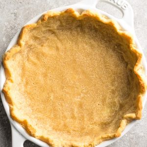 Top view of a baked Keto Gluten Free pie crust in a pie plate