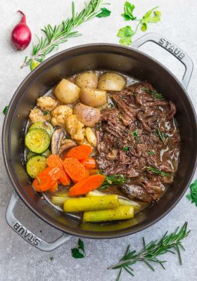 Top view of Instant Pot Pot Roast with shredded meat, celery, carrots and turnips.