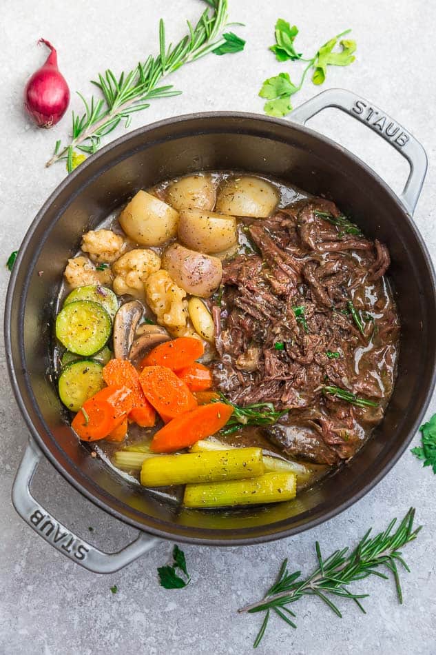 Top view of Instant Pot Pot Roast with shredded meat, celery, carrots and turnips.