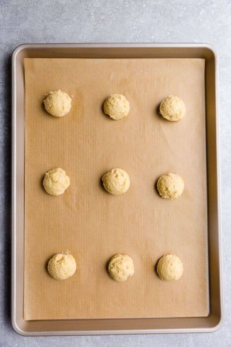 Top view of unbaked keto low carb lemon cookies on a baking sheet
