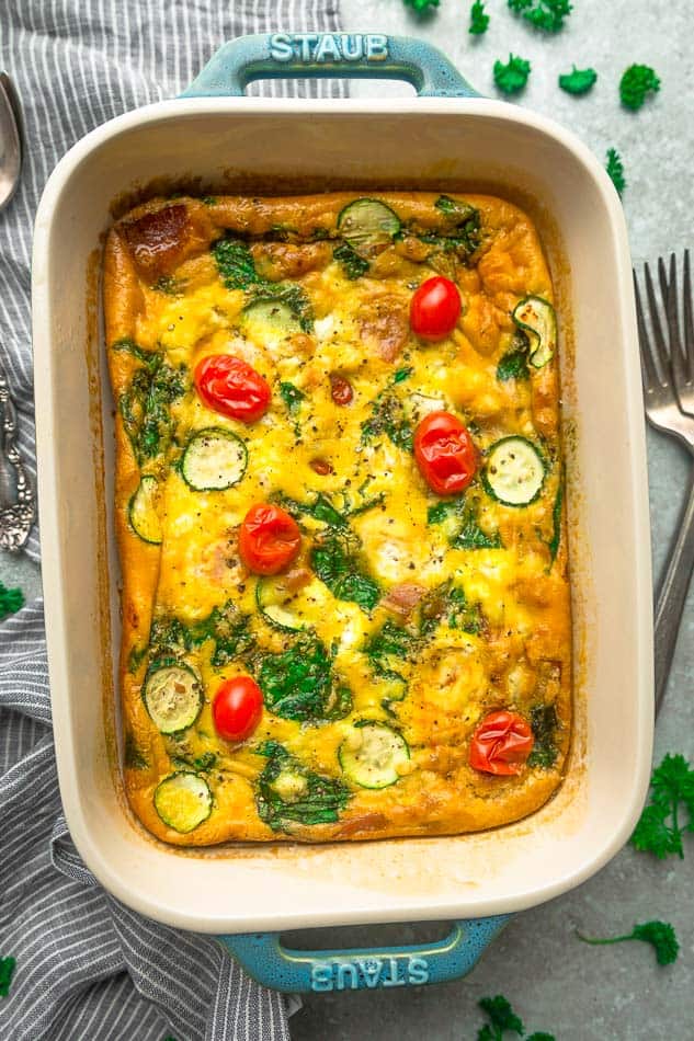 Close-up top view of low carb breakfast egg casserole in a blue casserole pan