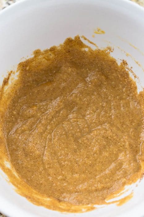 Top view of mixed batter in a white bowl to make keto pumpkin pie