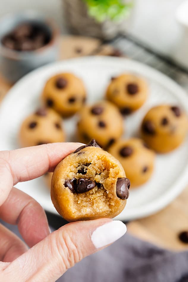 Side view of a hand holding easy cookie dough bites