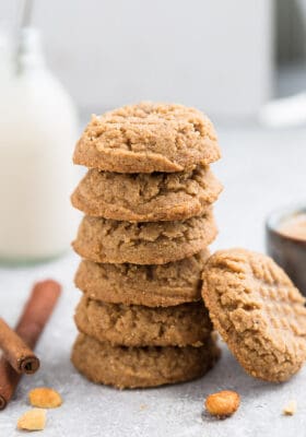 A stack of keto peanut butter cookies with criss-cross designs on top of each cookie