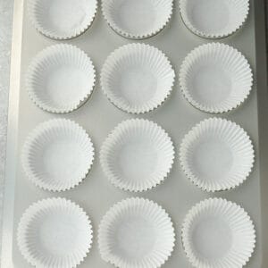 Top view of 12 cup muffin pan with muffin liners
