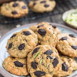 A plate of zucchini cookies on a grey plate on a wooden background