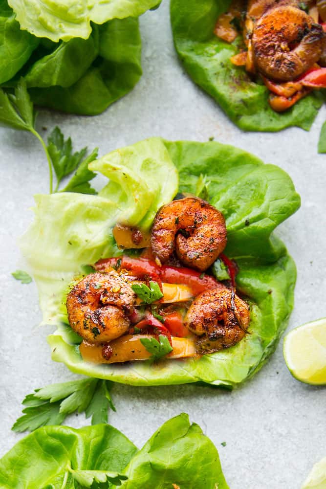 Shrimp Fajita Lettuce Wraps -  fresh, flavorful and a healthier way to enjoy fajitas! Less than 30 minutes to make and perfect for lunch or a lightened up dinner for busy weeknights!