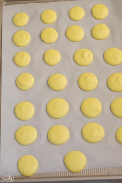 Lemon French Macarons filled with coconut buttercream make the perfect sweet treat for spring!