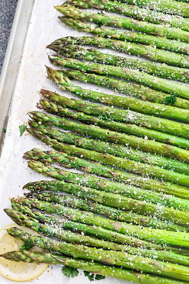 Lemon Parmesan Roasted Asparagus is the perfect quick and easy side dish for holidays or any night of the week. Best of all, this recipe only requires 5 minutes of prep with fresh lemon juice, garlic and Parmesan.