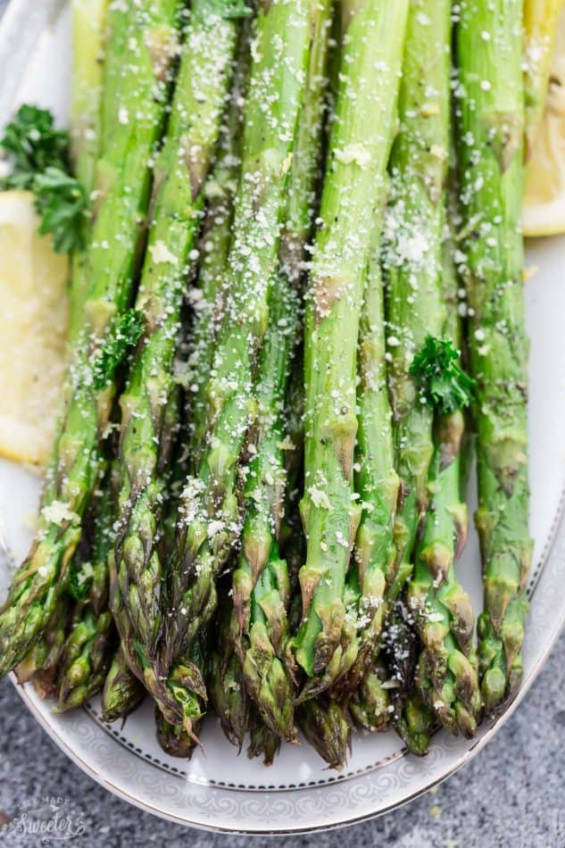 Lemon Parmesan Roasted Asparagus is the perfect quick and easy side dish for holidays or any night of the week. Best of all, this recipe only requires 5 minutes of prep with fresh lemon juice, garlic and Parmesan.