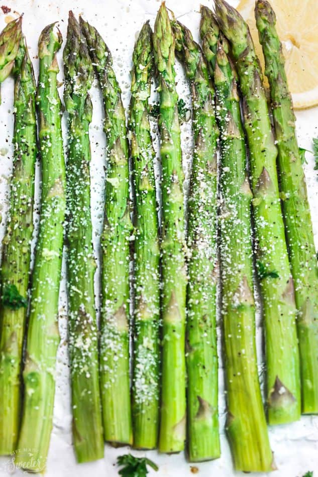 Lemon Parmesan Roasted Asparagus is the perfect quick and easy side dish for holidays or any night of the week. Best of all, this recipe only requires 5 minutes of prep with fresh lemon juice, garlic and Parmesan.