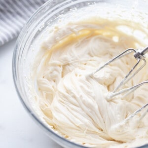 Top view of cream cheese frosting in a mixing bowl